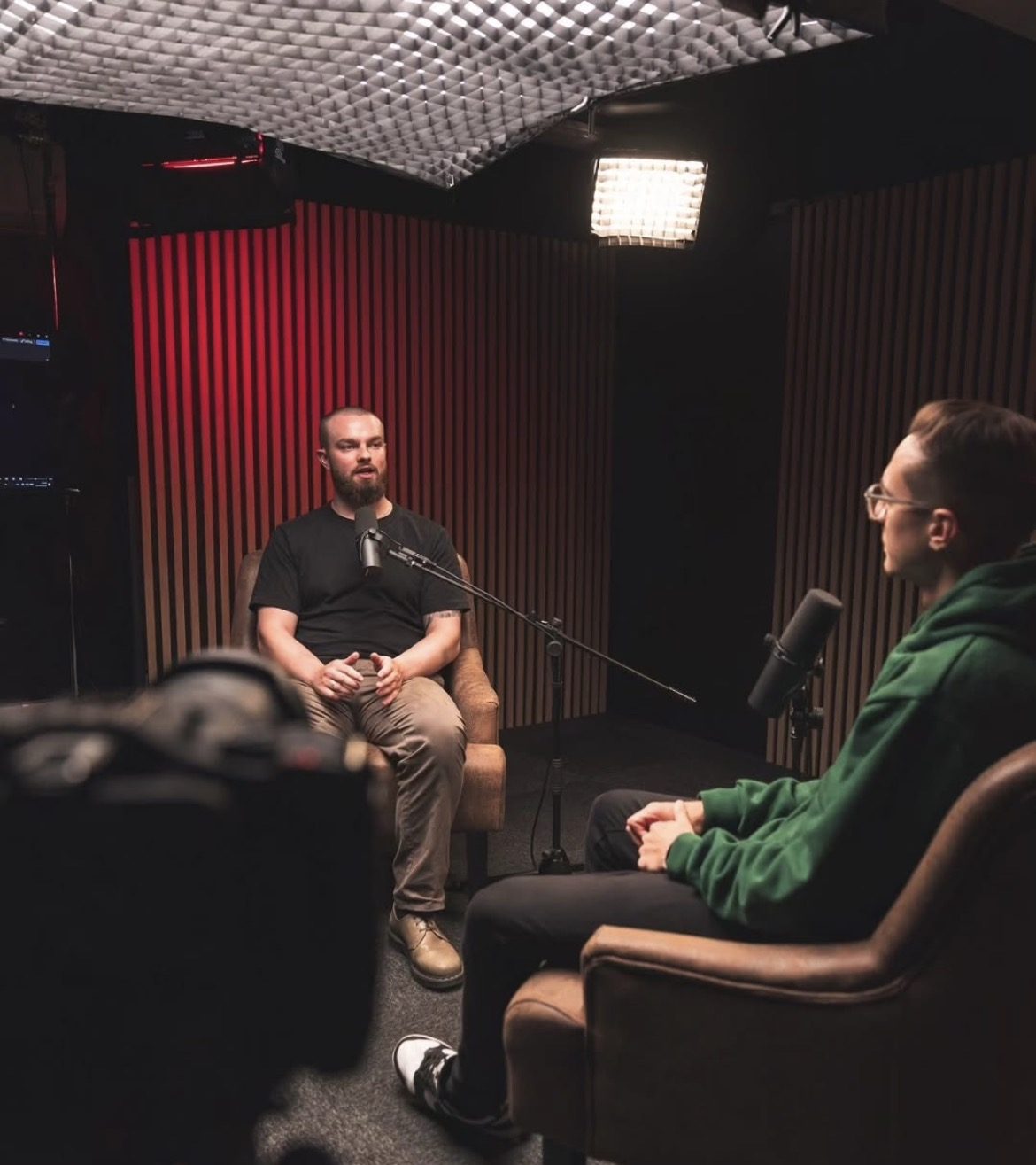 Tiarnan being interviewed in a podcast studio